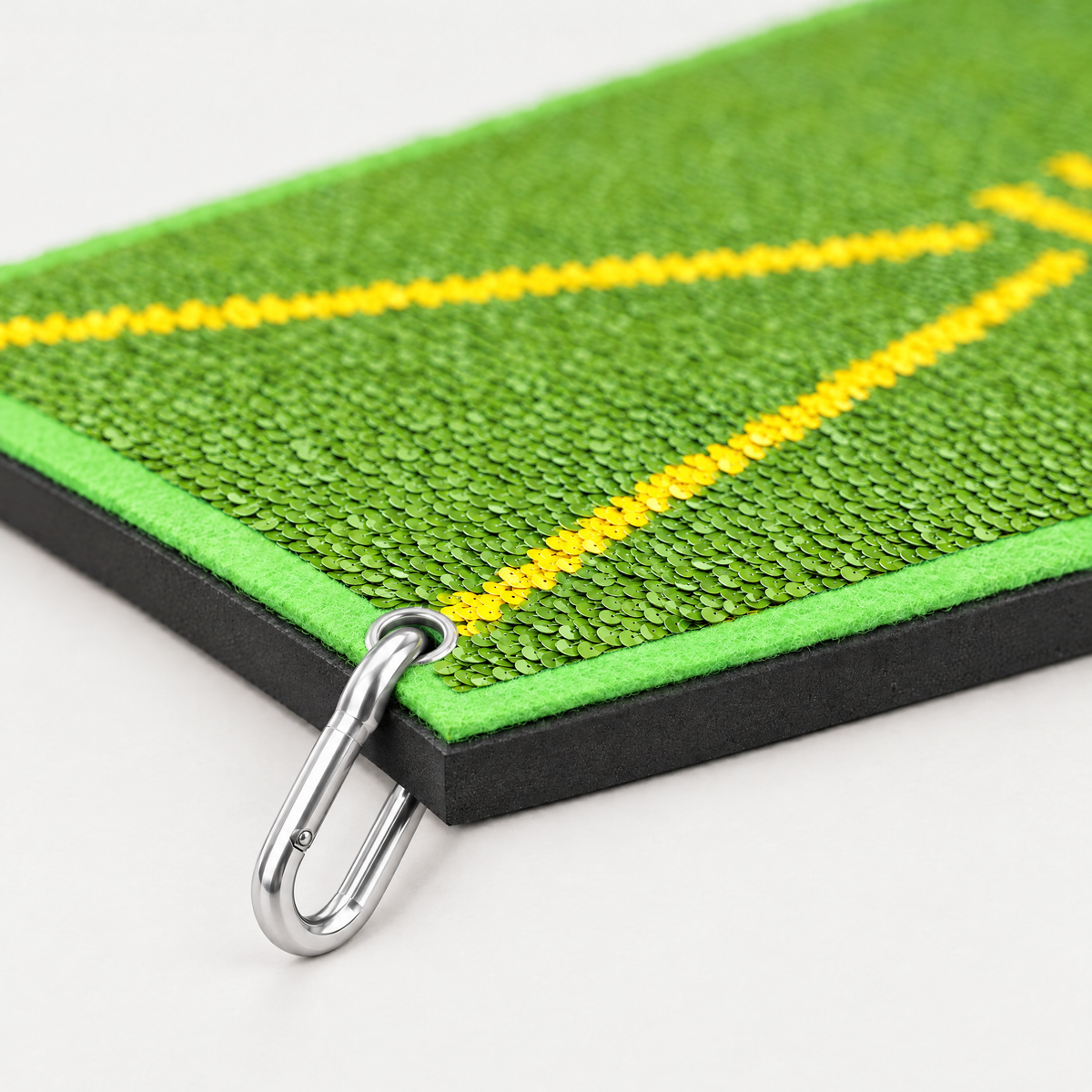 1 cm black rubber base, lime felt border and carabiner clip through the corner eyelet