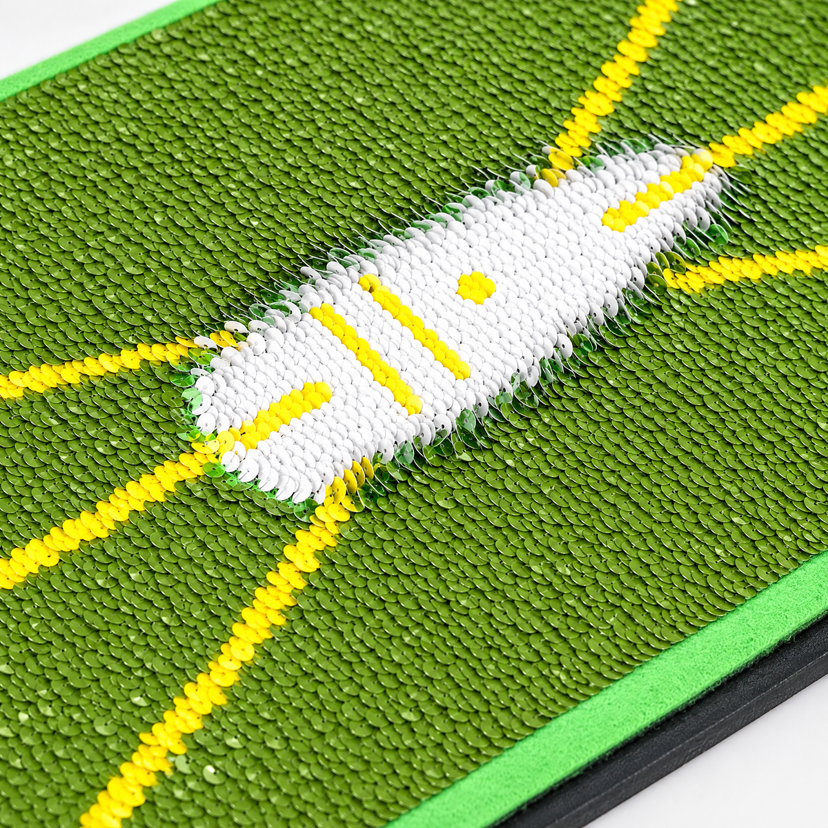 Close-up of the white strike trace left on the green sequins