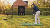 Golfer hitting a driver into the 10 ft practice net in a garden